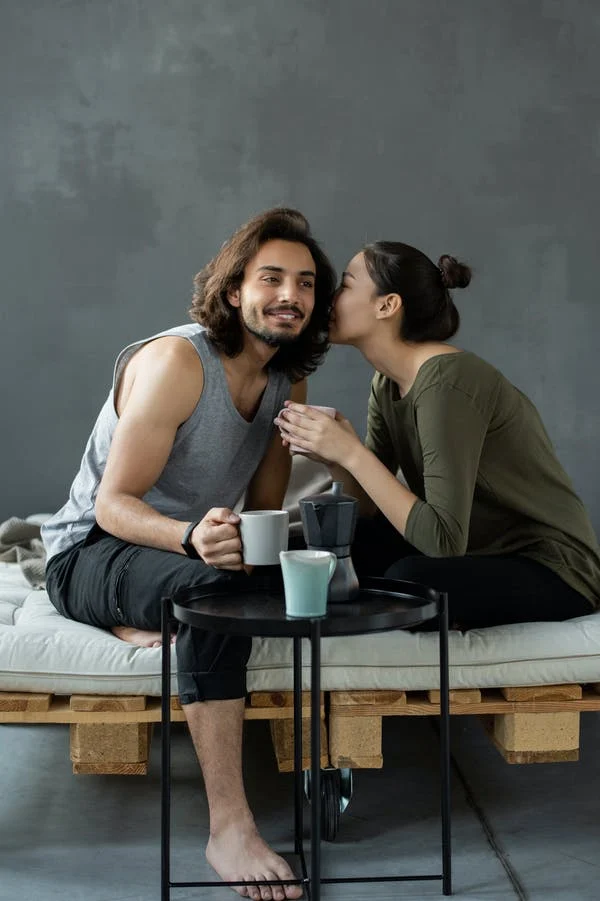 Premium Photo | Couple sitting on a bench in romantic pose